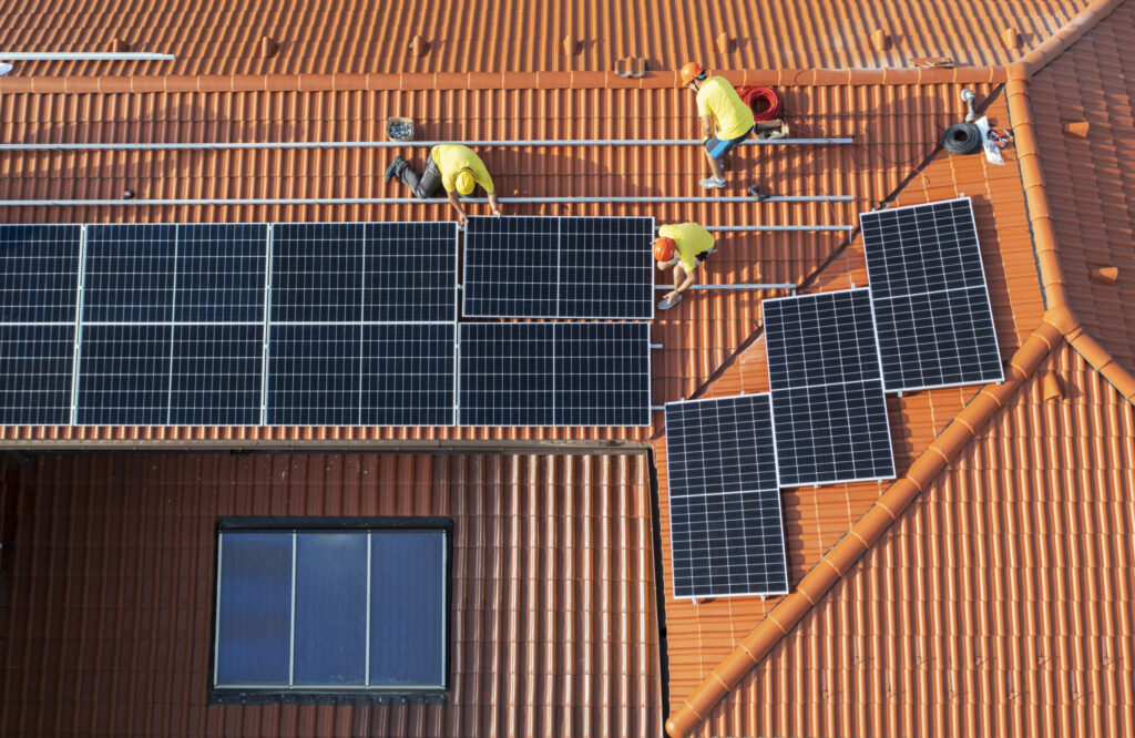 Solar panels on a rooftop, shot from birds eye view.